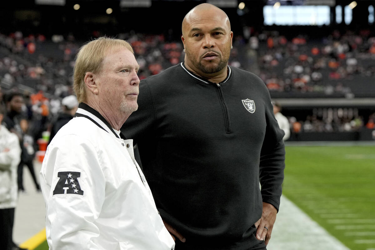 Las Vegas Raiders Head Coach Antonio Pierce, right, and owner Mark Davis talk prior to an NFL f ...