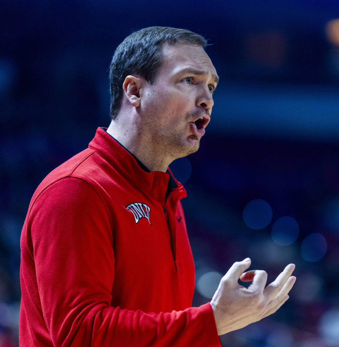 UNLV head coach Kevin Kruger argues a foul call for the Utah State Aggies during the first half ...