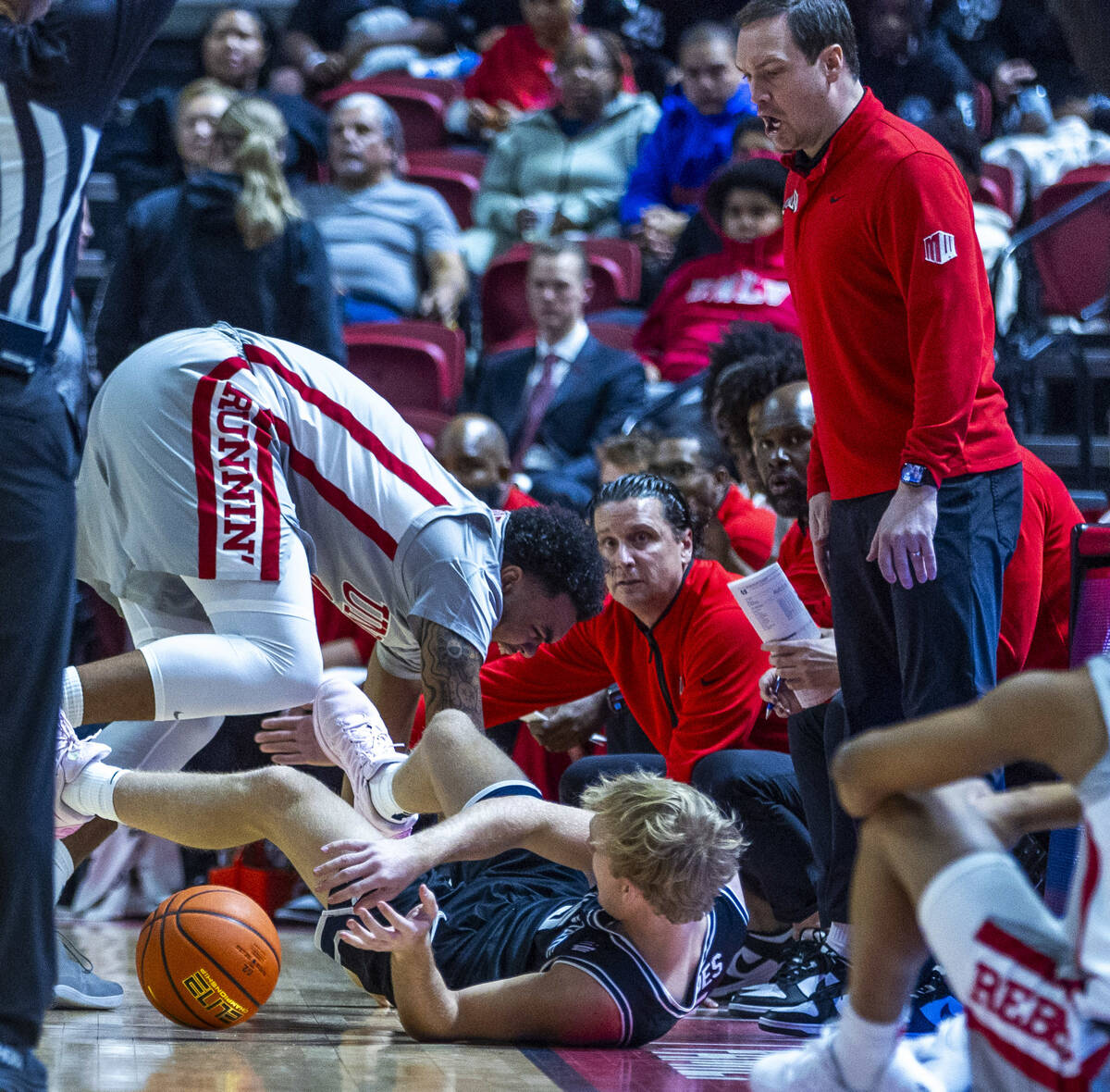 UNLV forward Jeremiah Cherry (45) collides with Utah State Aggies forward Karson Templin (22) a ...