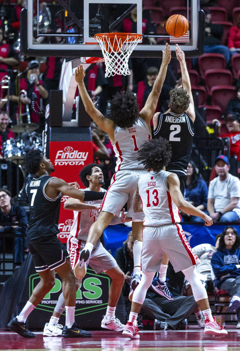 UNLV forward Jalen Hill (1) blocks a shot by Utah State Aggies forward Tucker Anderson (2) duri ...