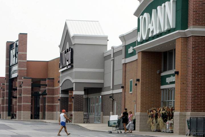 People walk into and out of a Joann store, Sept. 6, 2007, in Garfield Heights, Ohio. (AP Photo/ ...