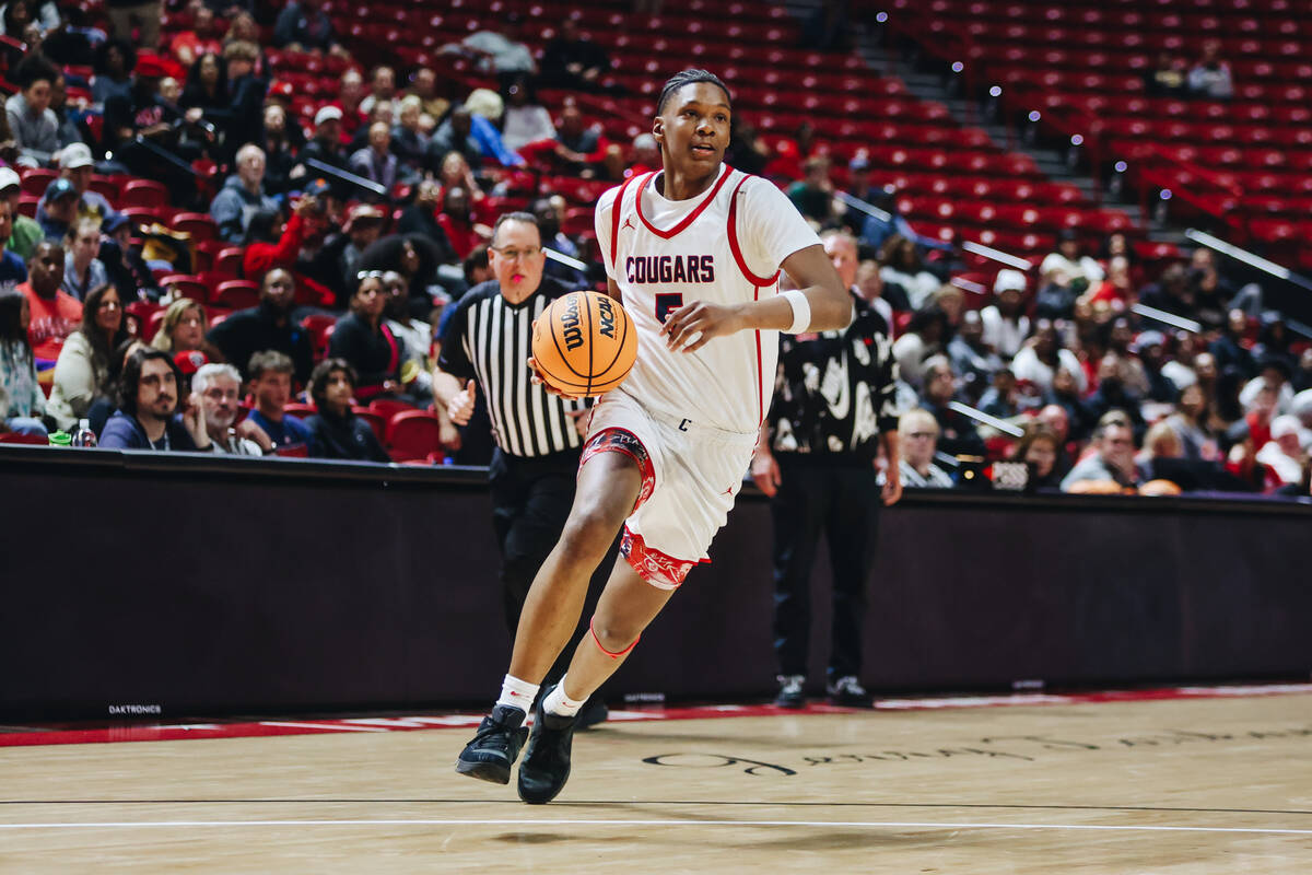 Coronado wing Lantz Stephenson (5) dribbles the ball during a Class 5A boys basketball state se ...