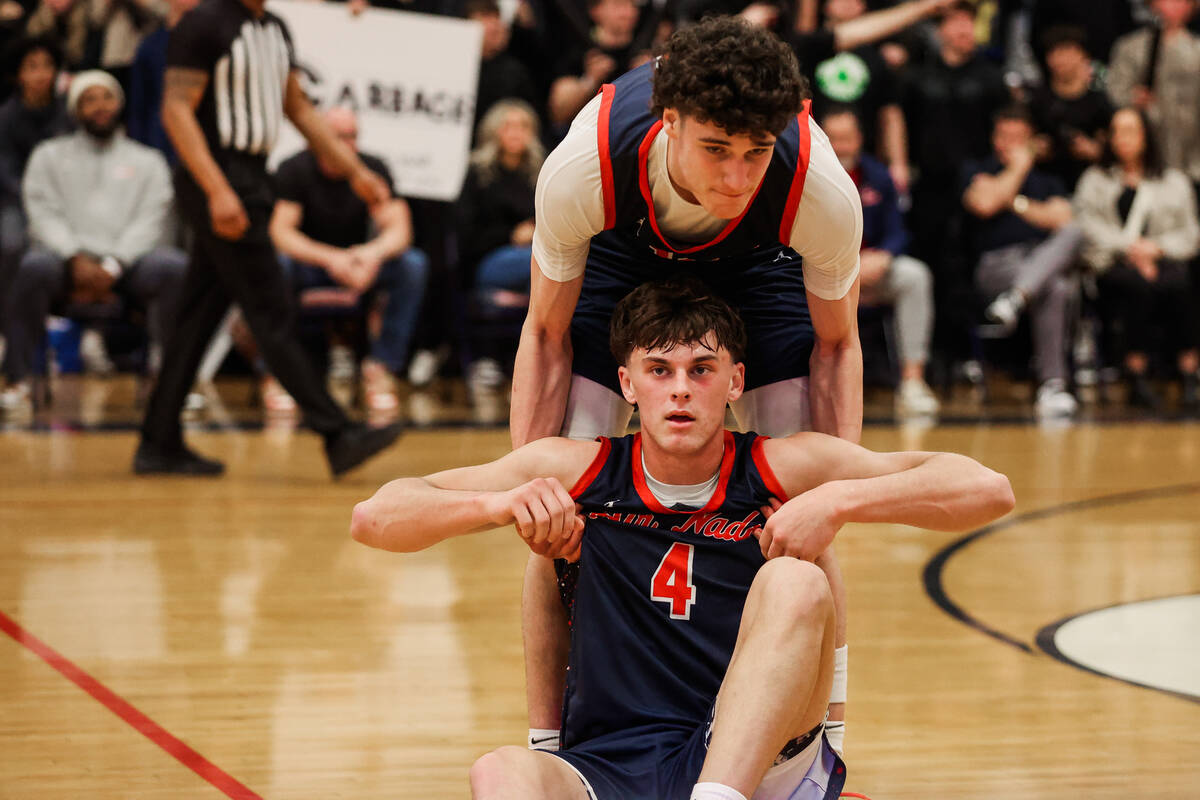 Coronado’s Mason Abittan (10) helps fellow teammate JJ Buchanan up after a fall during a ...