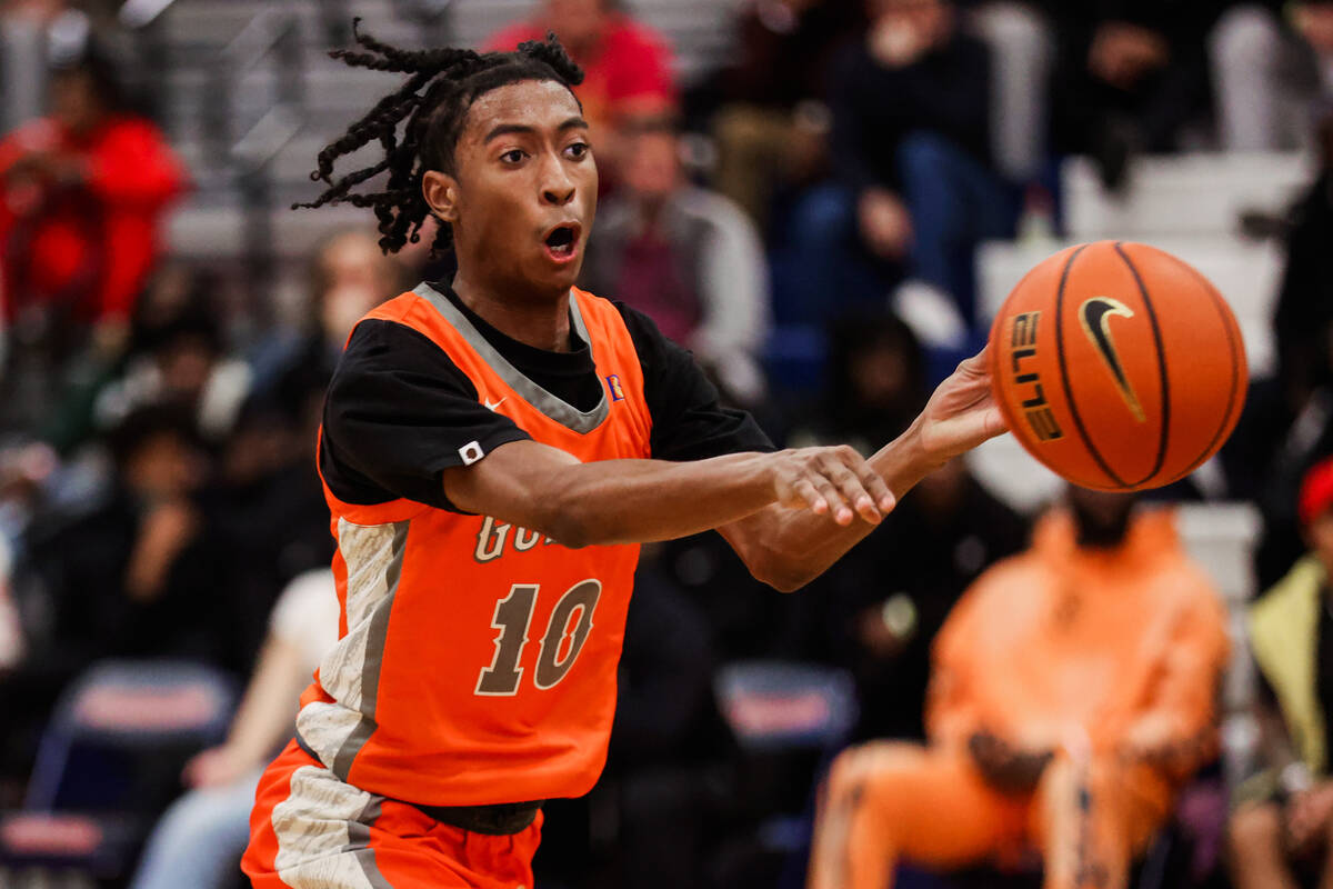 Bishop Gorman guard Nick Jefferson (10) passes the ball off during a high school boys basketbal ...