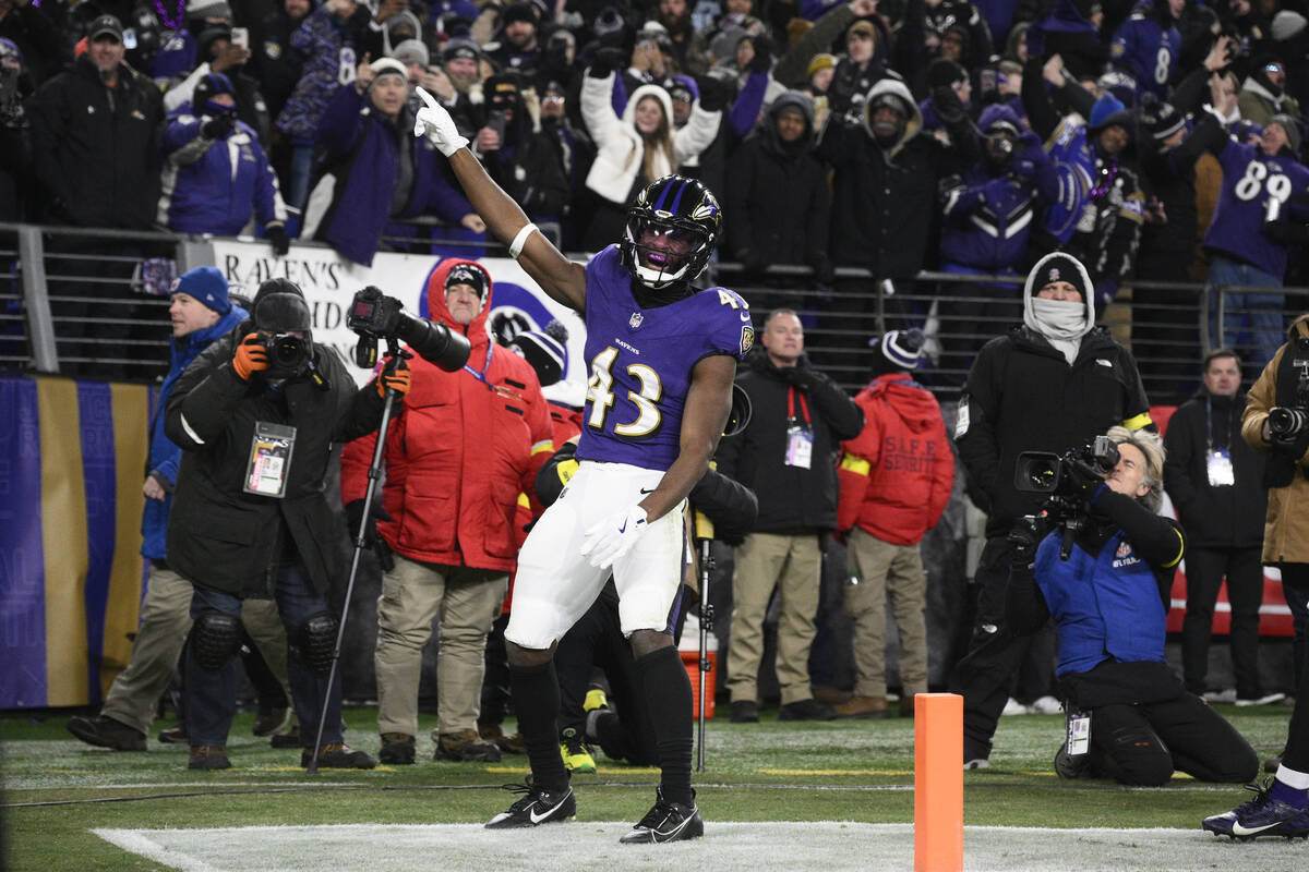 Baltimore Ravens running back Justice Hill (43) celebrates his touchdown during the first half ...