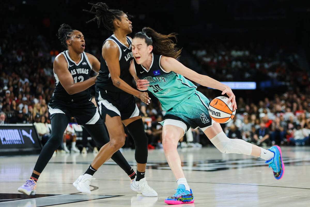 New York Liberty forward Breanna Stewart (30) drives through defense by Aces guard Tiffany Haye ...