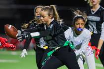 Palo Verde running running back Samantha Manzo (26) runs the ball as her flag is snagged during ...