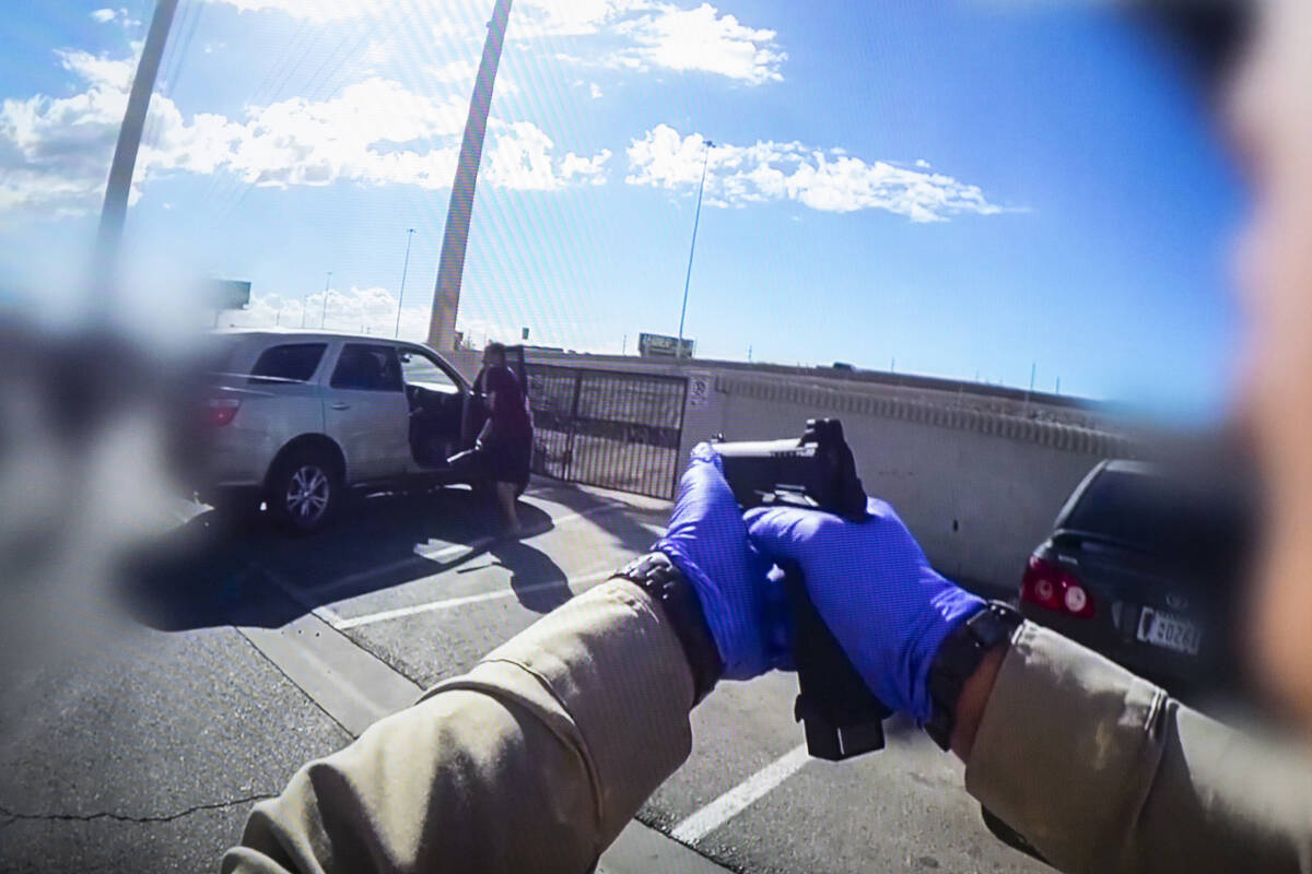 Body camera footage shows a Metro Police Department officer aiming a firearm at Kyle Norris as ...