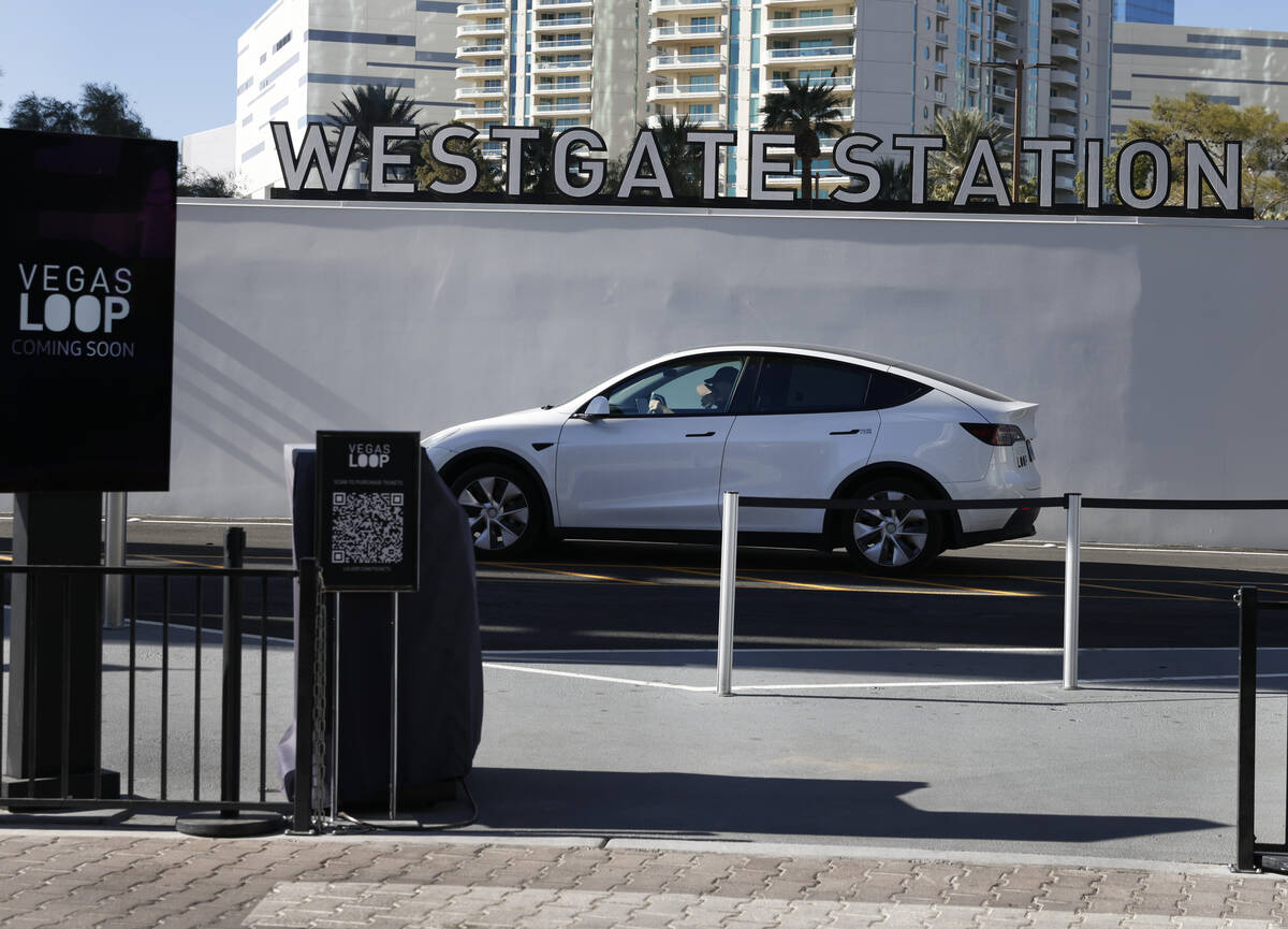 A Tesla with passengers leaves the Westgate's Vegas Loop station, an underground transportation ...