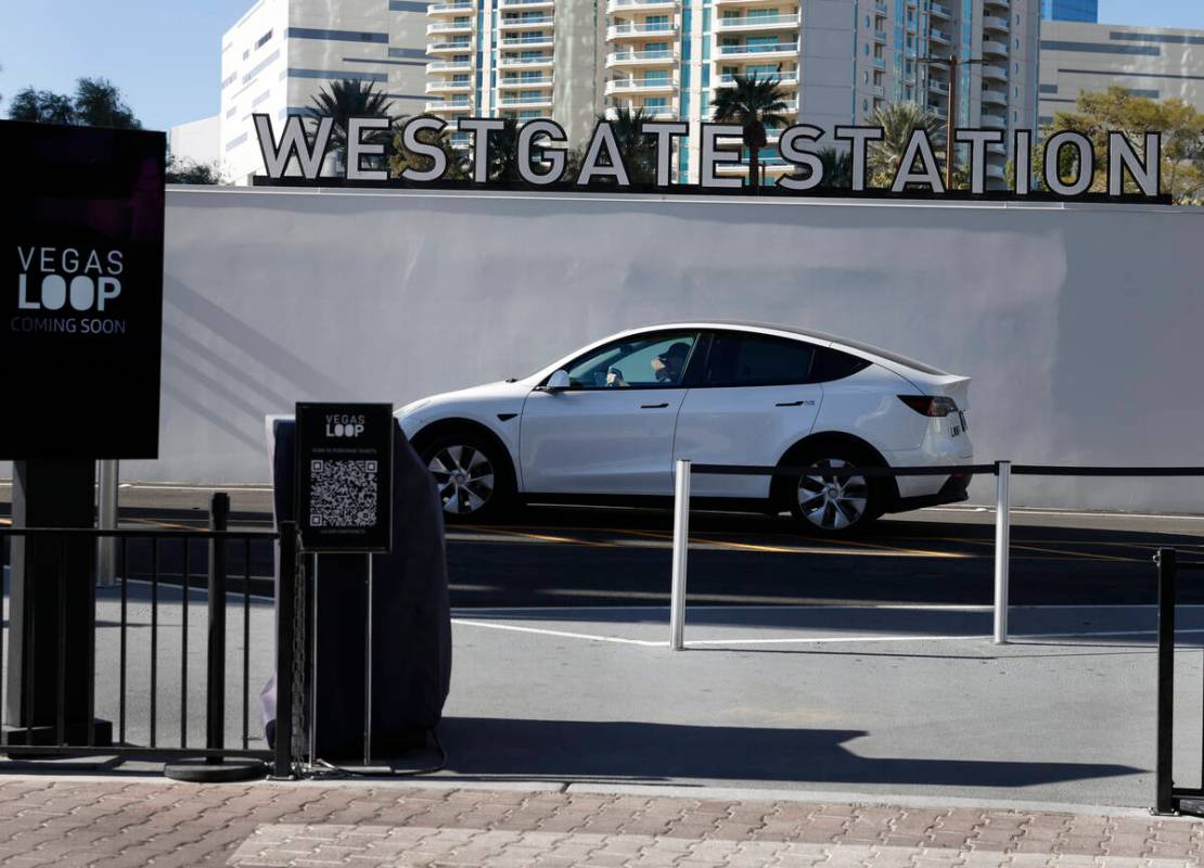 A Tesla with passengers leaves the Westgate's Vegas Loop station, an underground transportation ...