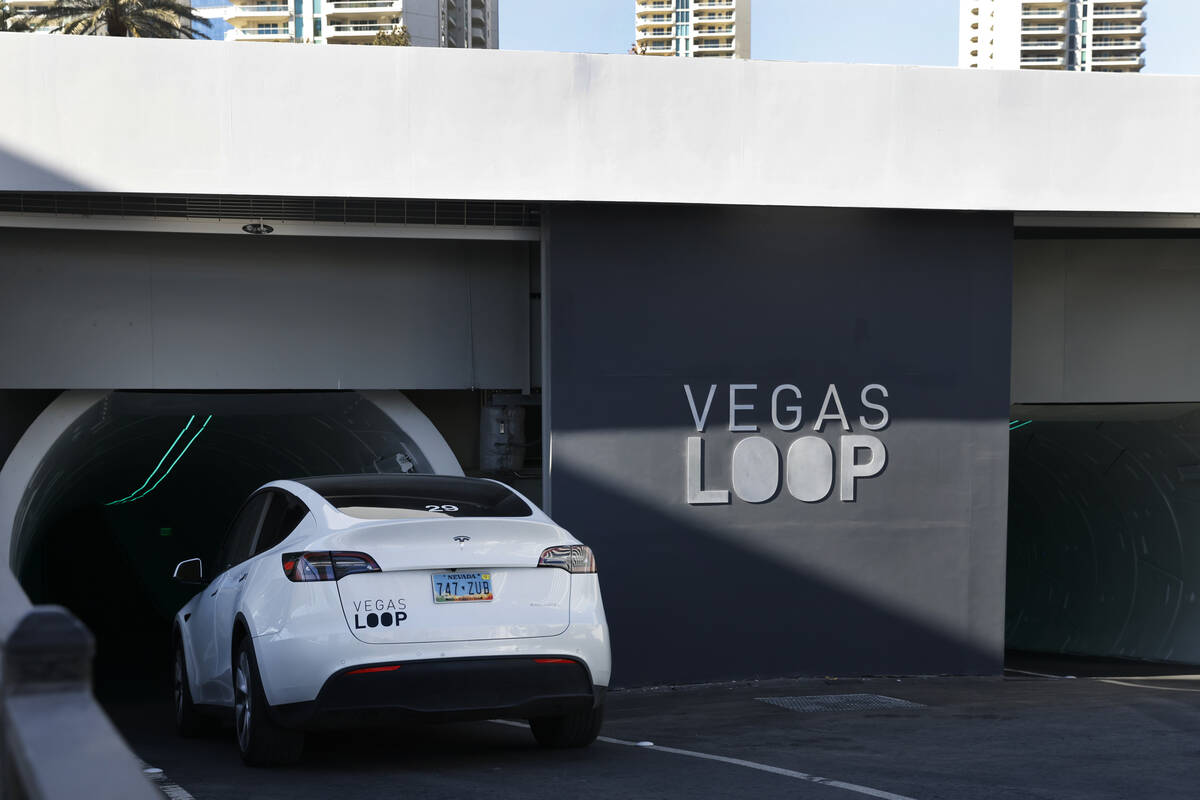 A Tesla enters an underground transportation system at the Westgate's Vegas Loop station, on Fr ...