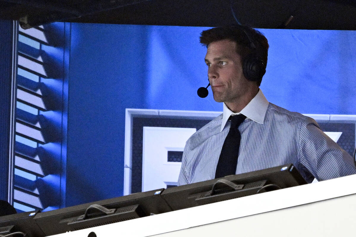 Former NFL quarterback Tom Brady looks on from the broadcast booth during the second half of an ...