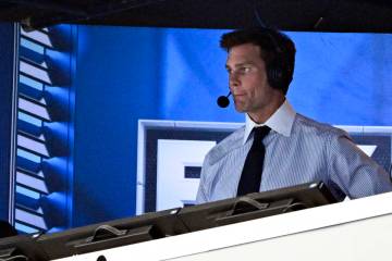 Former NFL quarterback Tom Brady looks on from the broadcast booth during the second half of an ...