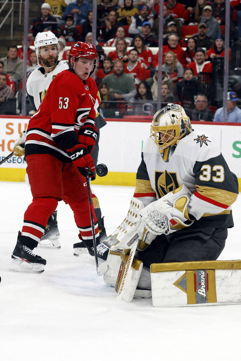 Vegas Golden Knights goaltender Adin Hill (33) blocks a shot as Carolina Hurricanes' Jackson Bl ...