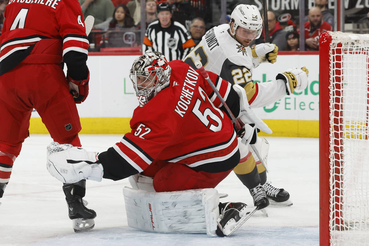 Carolina Hurricanes goaltender Pyotr Kochetkov (52) snares the puck intended for Vegas Golden K ...