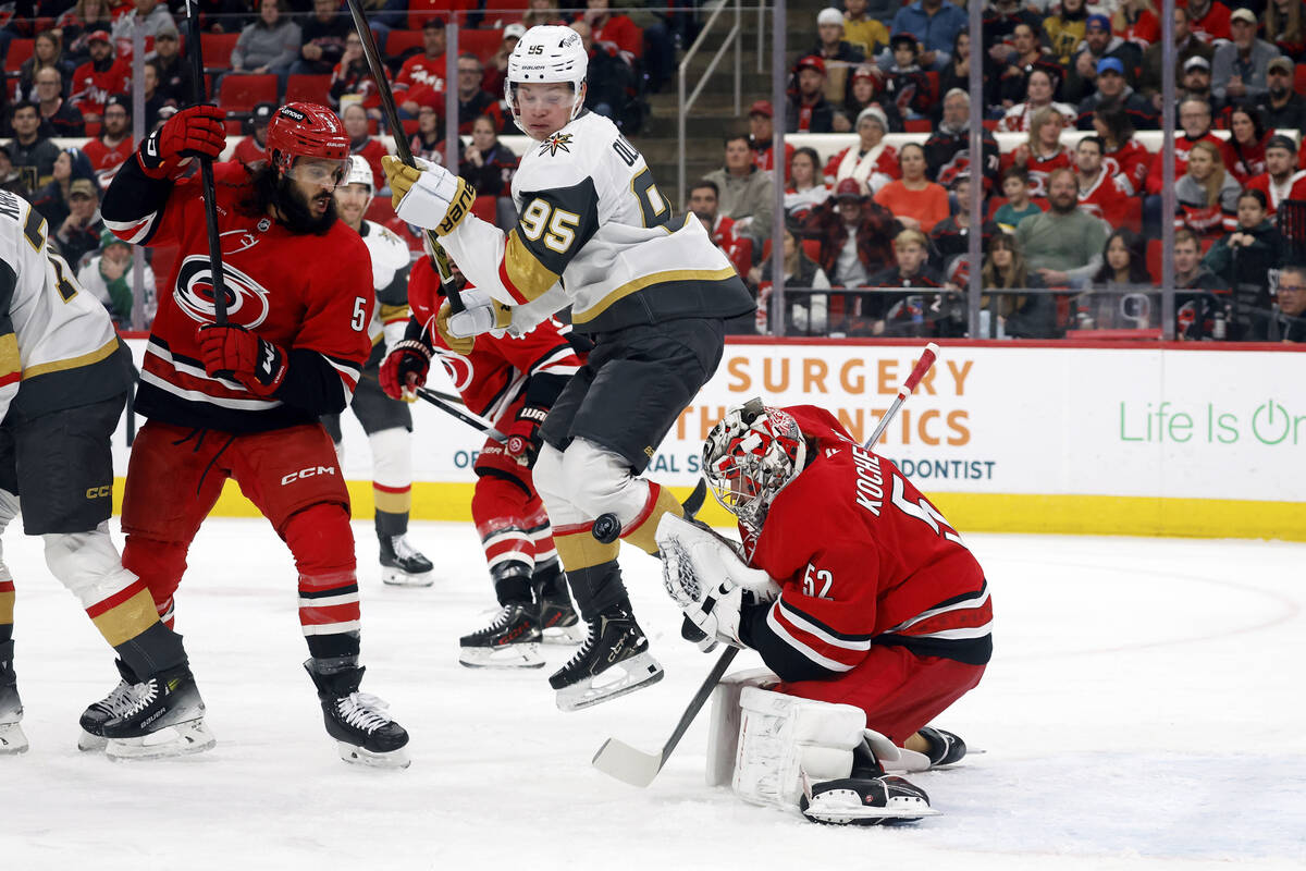 Vegas Golden Knights' Victor Olofsson (95) takes the puck off his knee in front of Carolina Hur ...