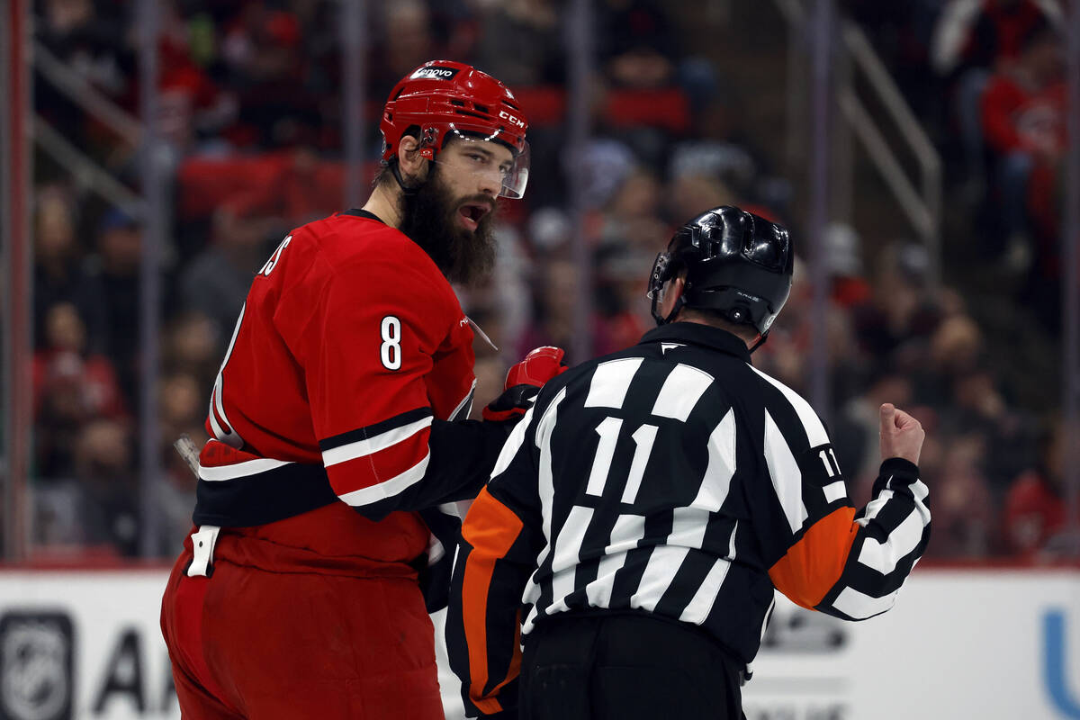 Carolina Hurricanes' Brent Burns (8) talks with an official during the second period of an NHL ...