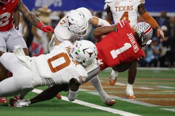 Ohio State running back Quinshon Judkins (1) scores past Texas defensive back Michael Taaffe, m ...