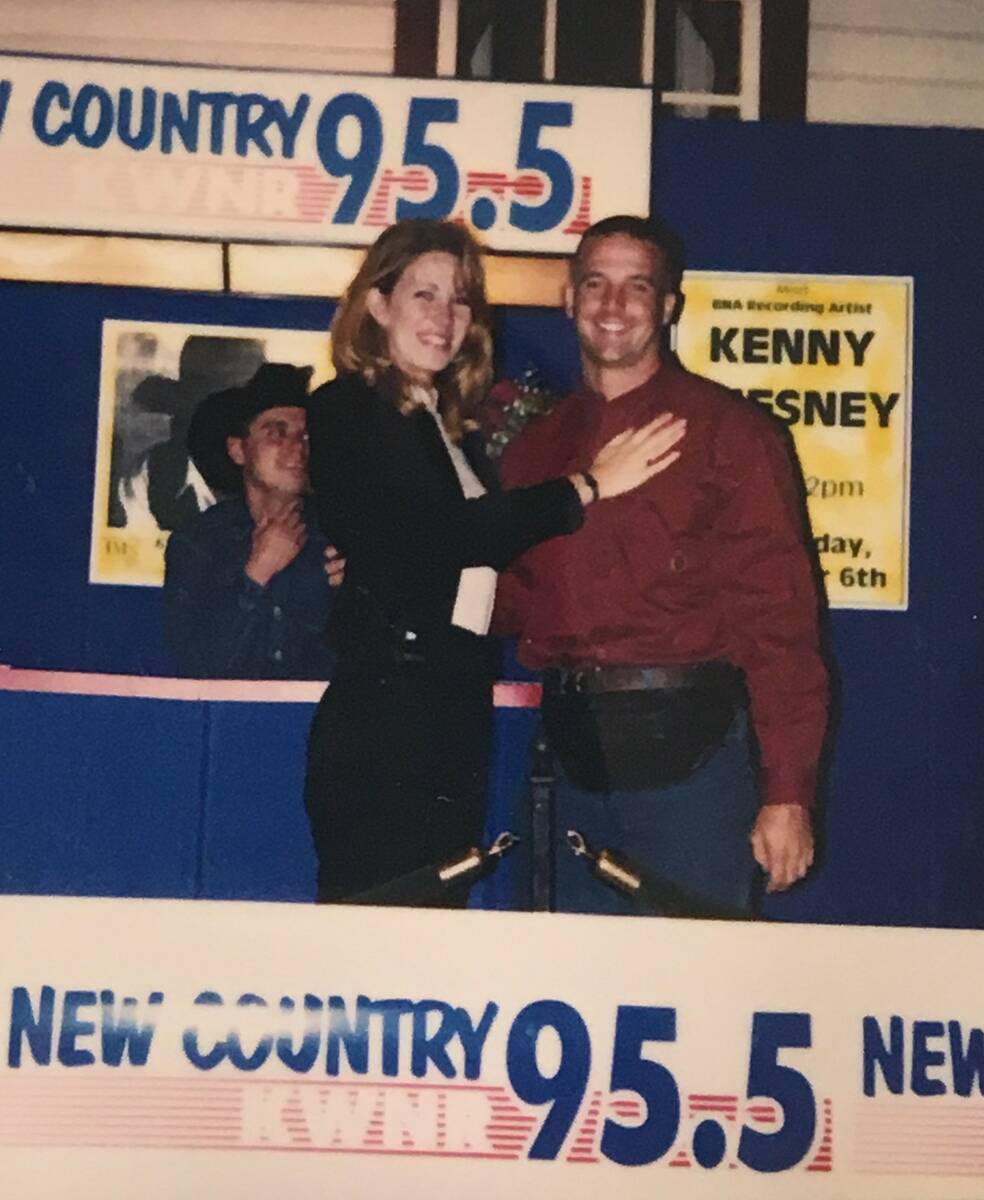 Dane and Lori Mattoon hug after Dean's proposal at Texas Station on Nov. 9, 1996. Budding count ...