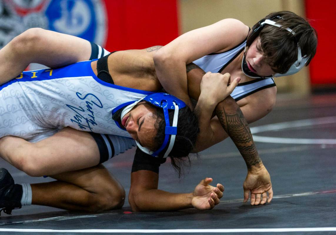 Sierra Vista's Makhi Clark is caught from behind by SLAM's Eric Bice during their 106 lb. fina ...