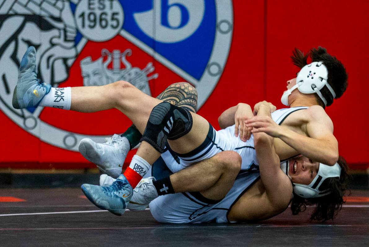 SLAM's Antonio Quiroz is pulled down by SLAM's Destin Maestas during their 113 lb. finals match ...