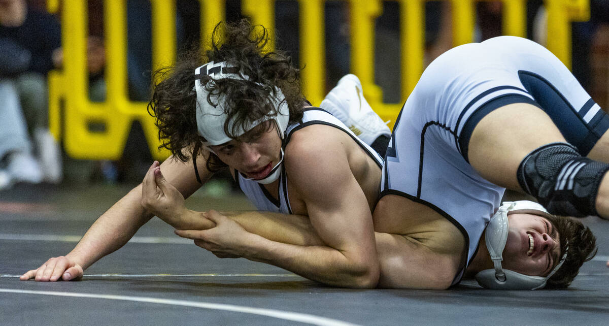 SLAM's Destin Maestas looks to pin SLAM's Antonio Quiroz during their 113 lb. finals match in t ...