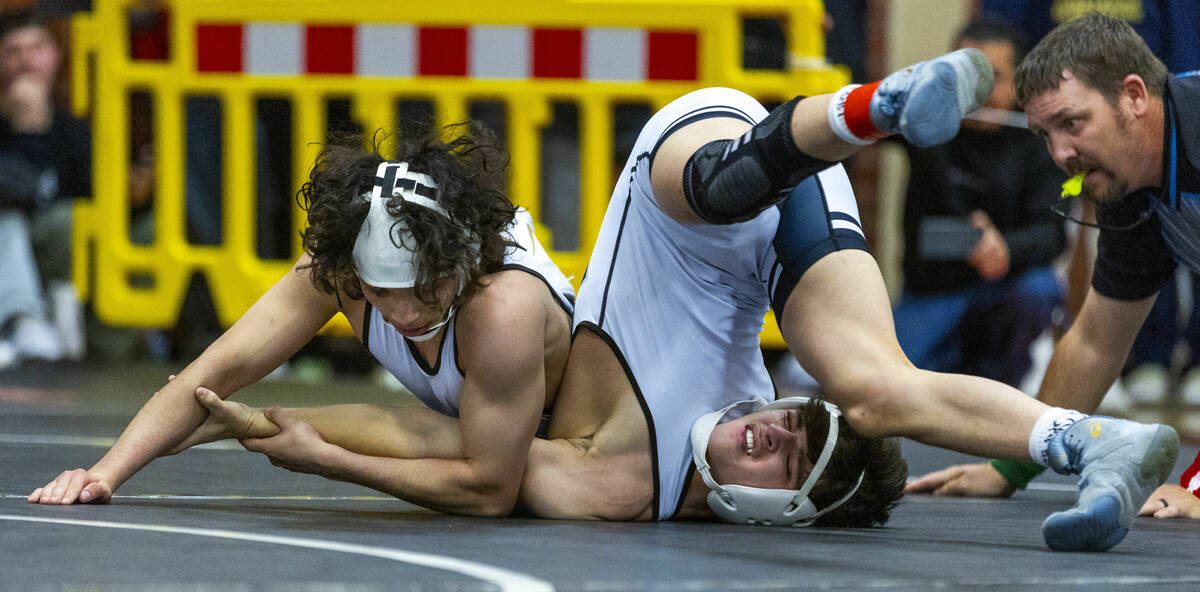 SLAM's Destin Maestas looks to pin SLAM's Antonio Quiroz during their 113 lb. finals match in t ...