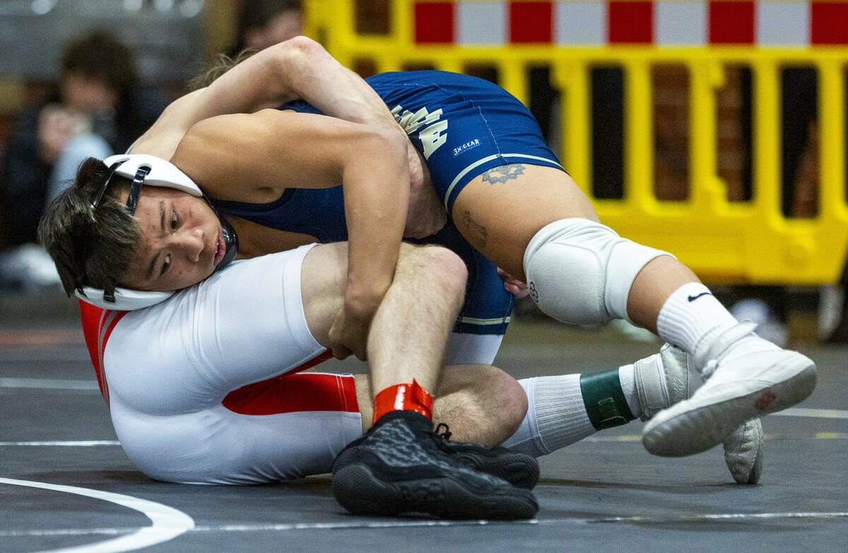 Cheyenne's Matthew Salvador-Agabin works to roll over Arbor View's Cole Faircloth for a possibl ...