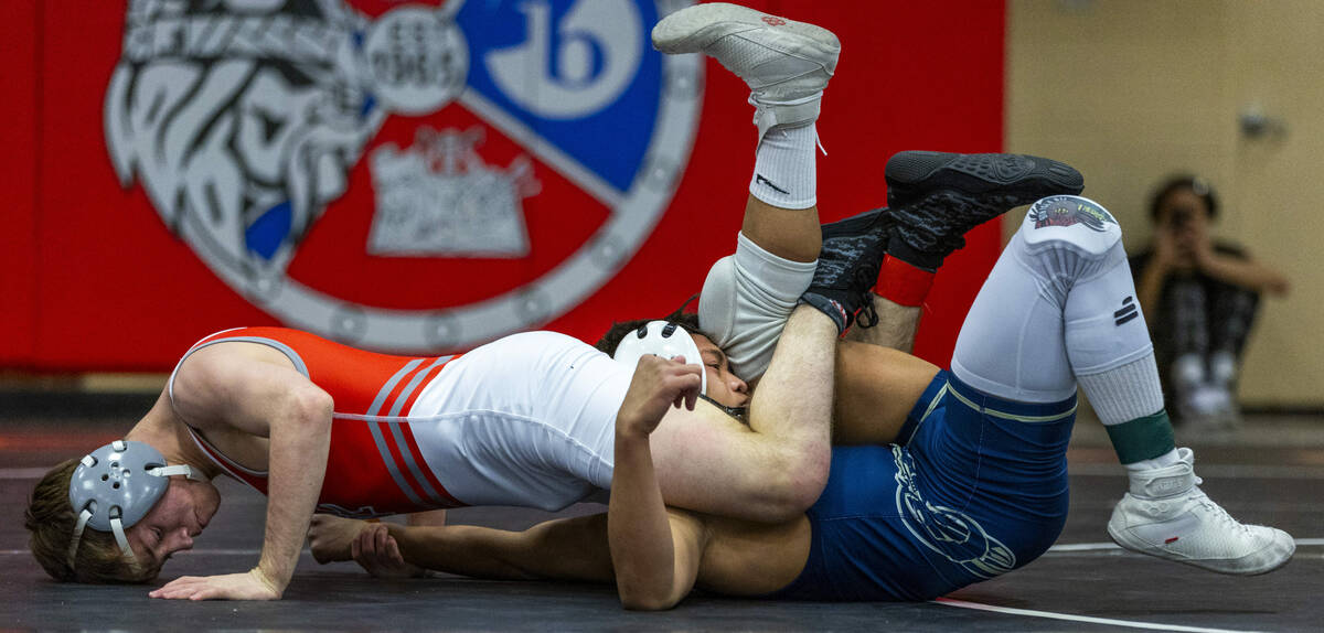 Arbor View's Cole Faircloth wraps up Cheyenne's Matthew Salvador-Agabin working for a possible ...