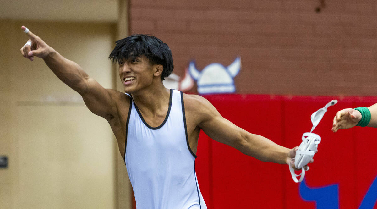 SLAM's Brenden Agcaolli celebrates his win against Mojave's Isaiah Hill during their 126 lb. fi ...