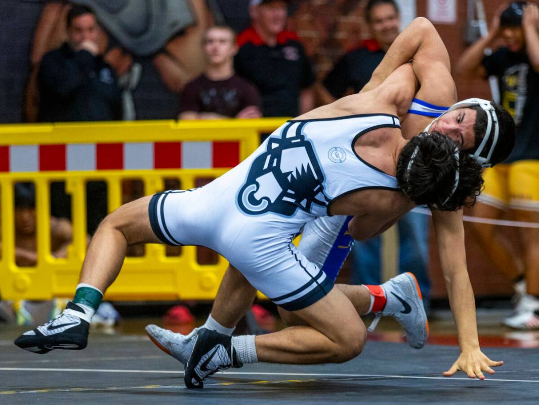 SLAM's Anthony Delgado battles to take down Sierra Vista's Sebastian Quintana to the mat during ...