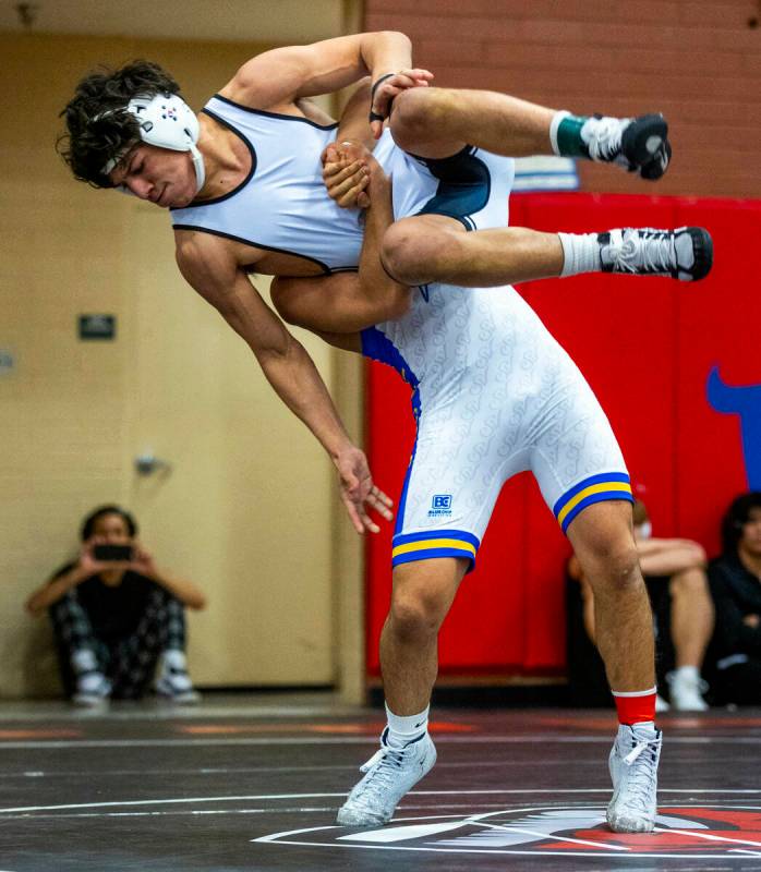 SLAM's Anthony Delgado is lifted into the air before taken down to the mat by Sierra Vista's Se ...