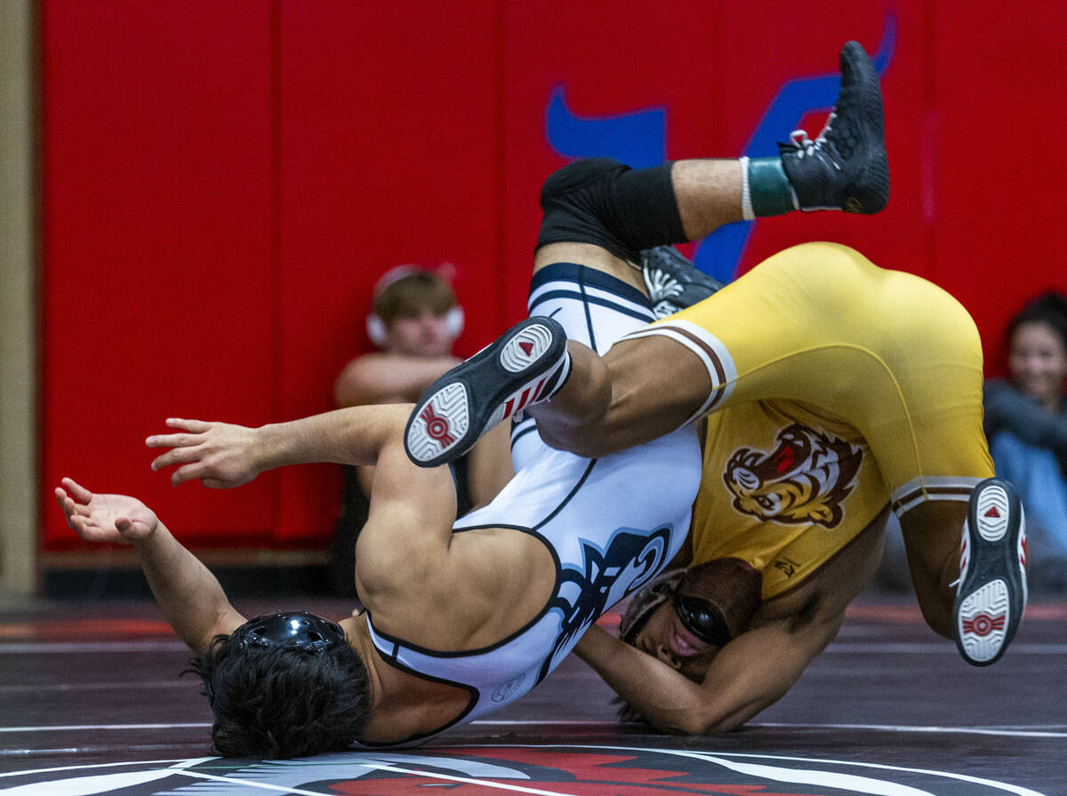 SLAM's Manuel Saldate is rolled over by Bonanza's Kanye Ilai-Simio during their 138 lb. finals ...