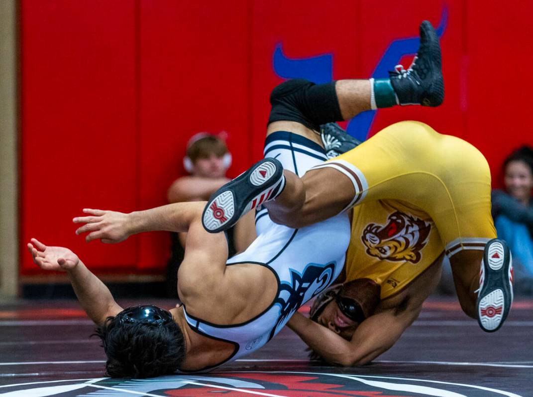 SLAM's Manuel Saldate is rolled over by Bonanza's Kanye Ilai-Simio during their 138 lb. finals ...