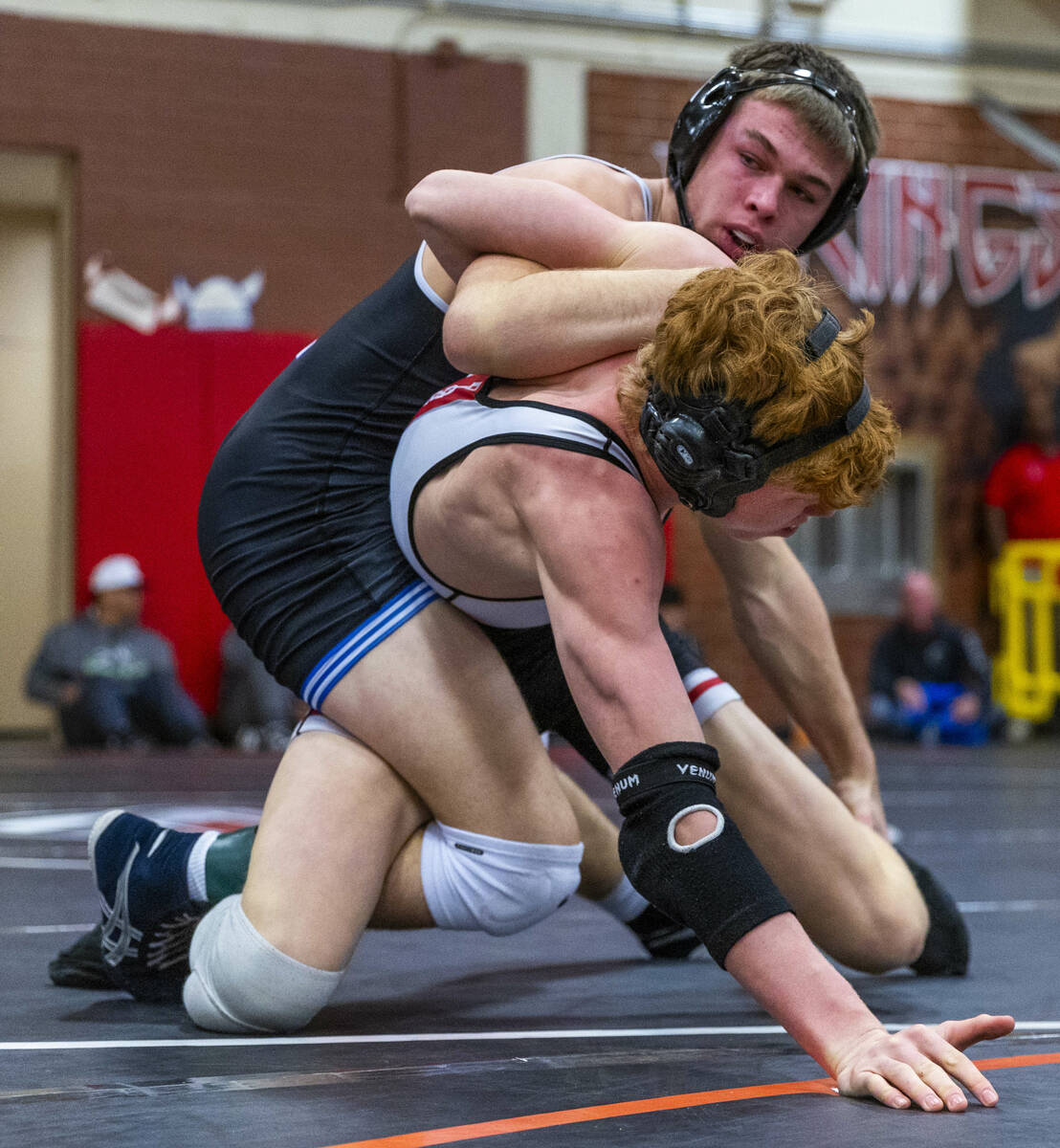 Pleasant Grove's Ian Fritz works to bring Desert Oasis' Chance Mannino down to the mat during t ...