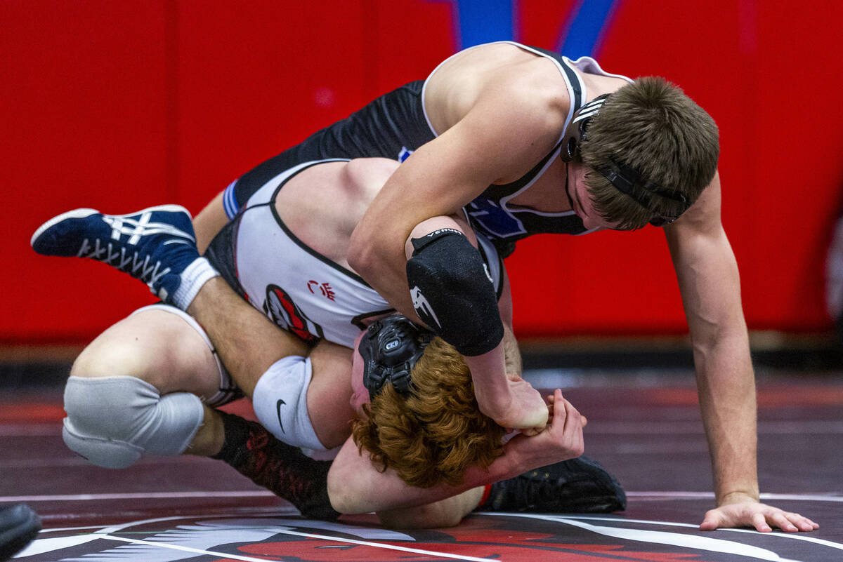 Pleasant Grove's Ian Fritz dominates Desert Oasis' Chance Mannino during their 157 lb. finals m ...