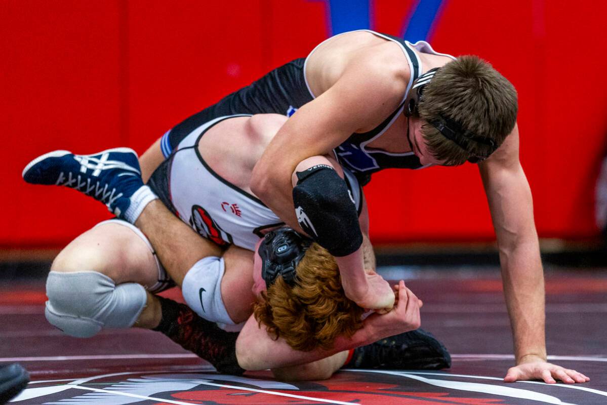 Pleasant Grove's Ian Fritz dominates Desert Oasis' Chance Mannino during their 157 lb. finals m ...