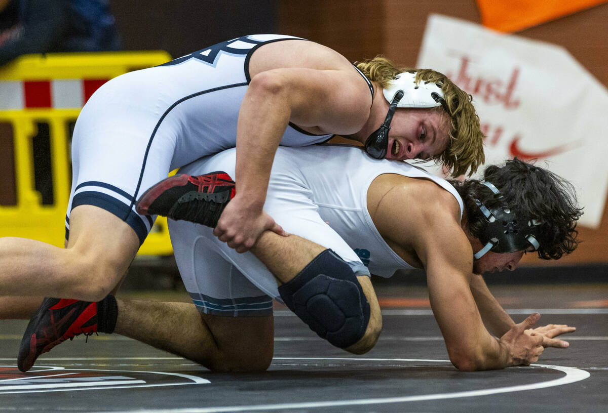 SLAM's Dylan Tondreau works to drive down Silverado's Bradley Britt during their 190 lb. finals ...