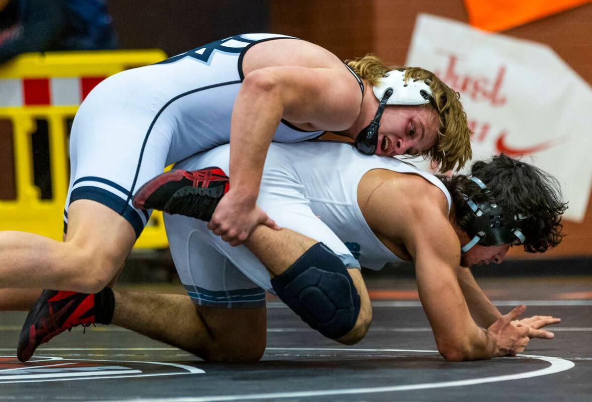 SLAM's Dylan Tondreau works to drive down Silverado's Bradley Britt during their 190 lb. finals ...