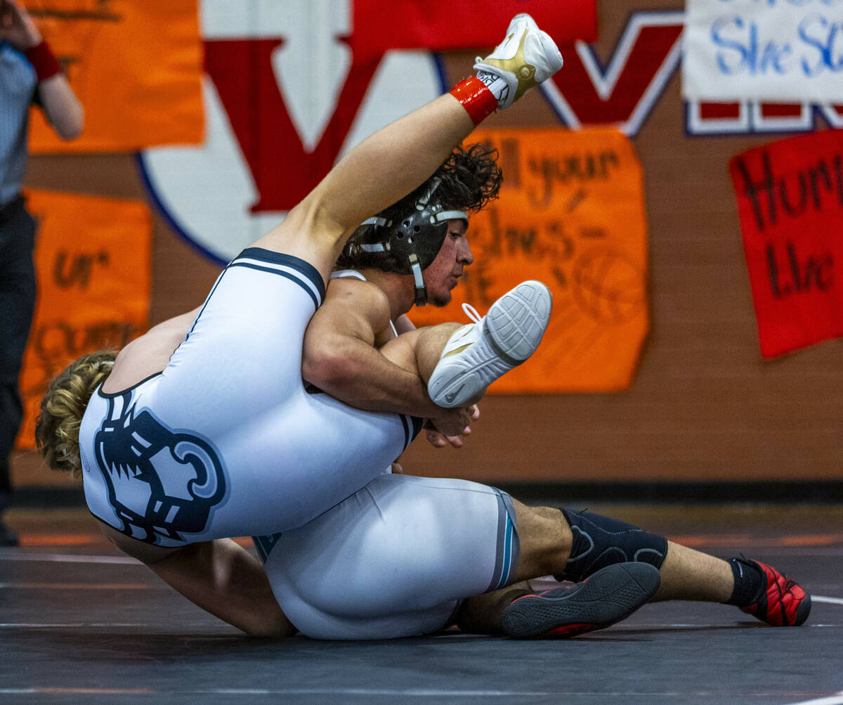 SLAM's Dylan Tondreau is rolled down to the mat by Silverado's Bradley Britt during their 190 l ...