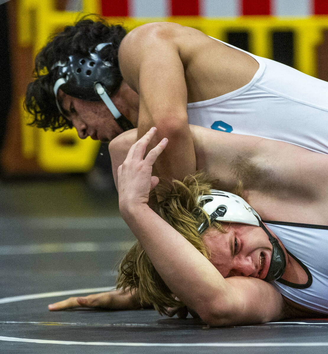 Silverado's Bradley Britt works to pin SLAM's Dylan Tondreau during their 190 lb. finals match ...