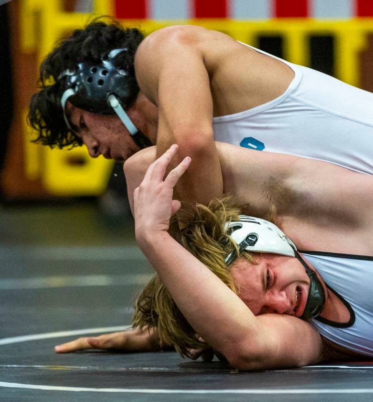 Silverado's Bradley Britt works to pin SLAM's Dylan Tondreau during their 190 lb. finals match ...