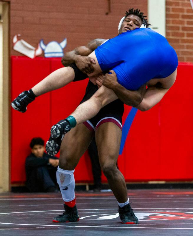 Liberty's Melvin Whitehead lifts up Desert Pines' Manuel Salazar before taking him to the mat d ...