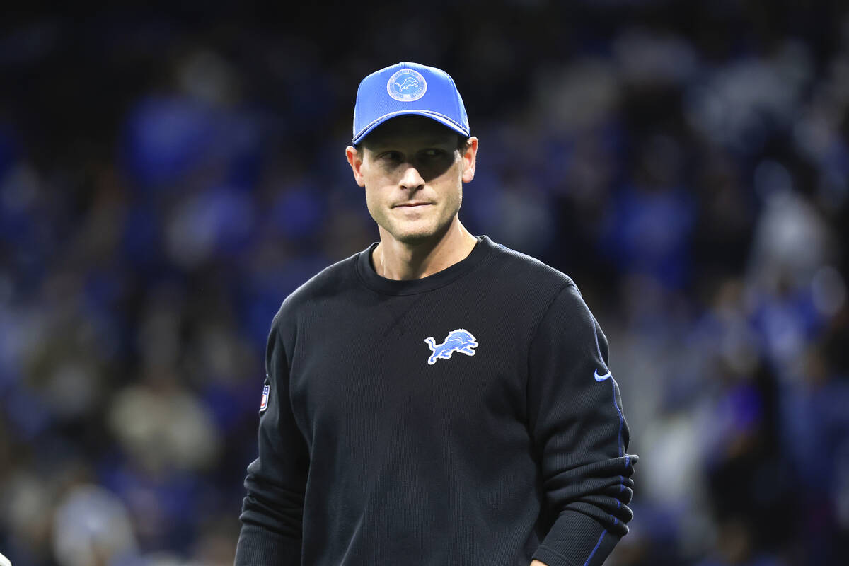 Detroit Lions offensive coordinator Ben Johnson watches during warmups before an NFL football d ...