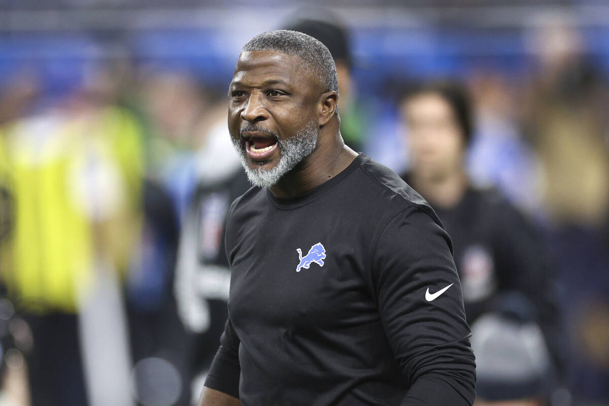 Detroit Lions defensive coordinator Aaron Glenn watches during warmups before an NFL football d ...