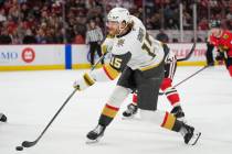 Vegas Golden Knights defenseman Noah Hanifin (15) shoots the puck during the third period of an ...