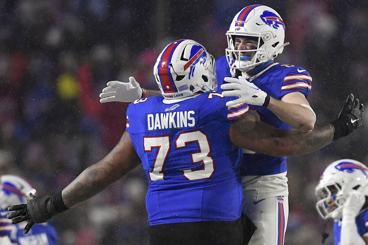 Buffalo Bills offensive tackle Dion Dawkins (73) and tight end Dalton Kincaid (86) celebrate as ...