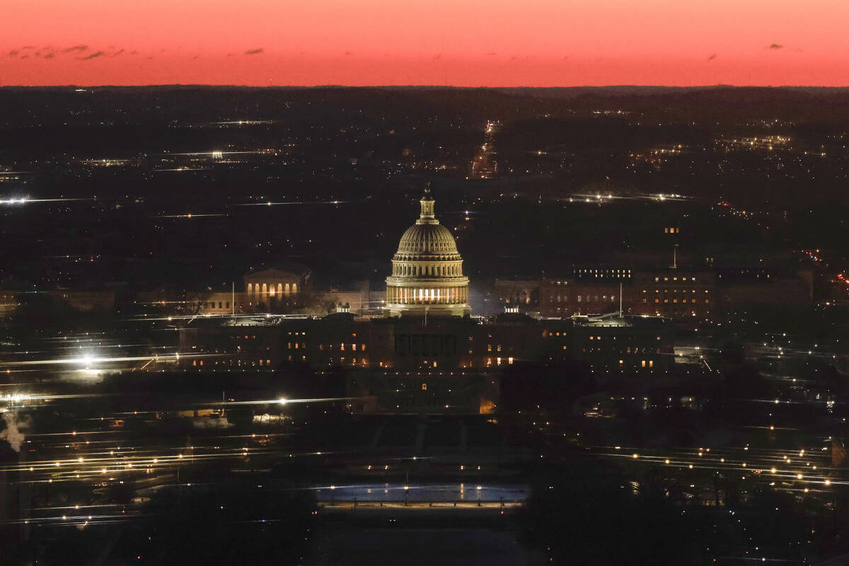 The U.S. Capitol is seen from the top of the Washington Monument at dawn on Inauguration Day, M ...