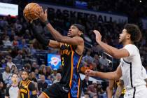 Oklahoma City Thunder guard Shai Gilgeous-Alexander (2) goes to the basket ahead of Brooklyn Ne ...