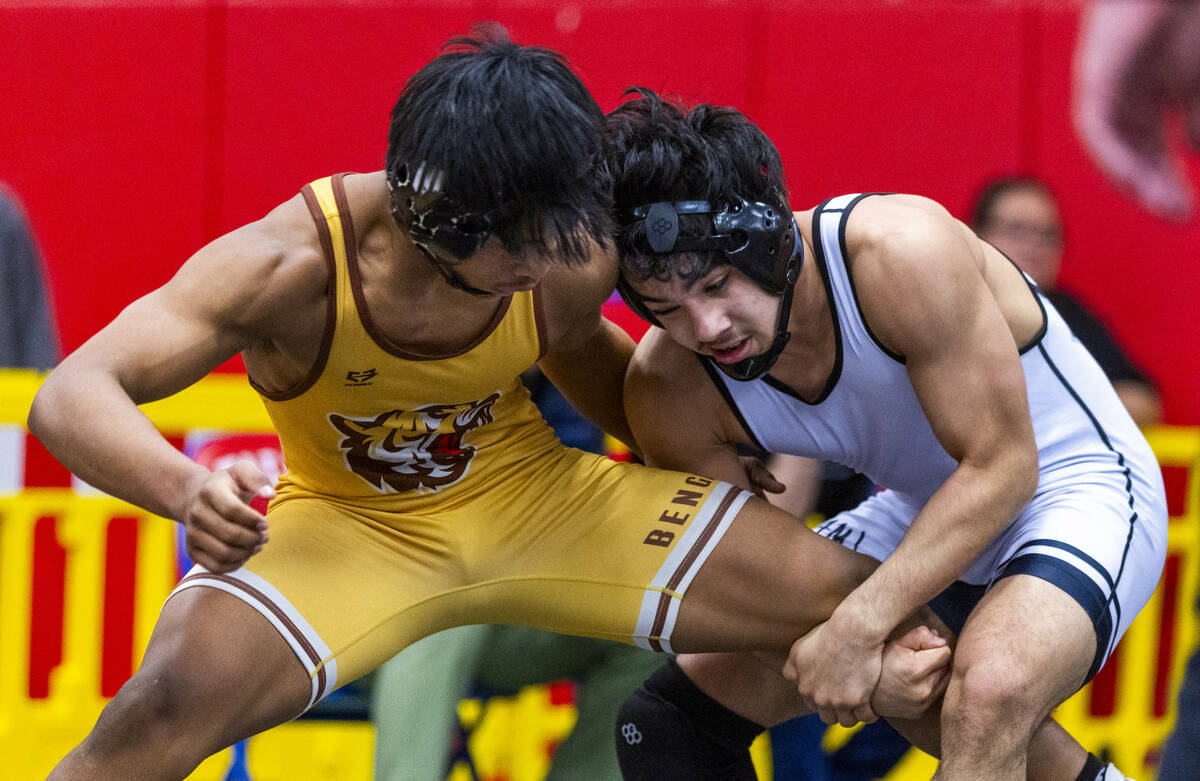 Bonanza's Kanye Ilai-Simio has his leg wrapped up by SLAM's Manuel Saldate during their 138 lb ...